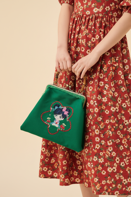 Cherry Girl Bag close-up hands