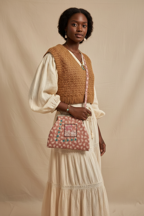 Model wearing paisley crossbody bag, no flowers in hair